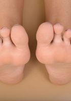 ATK Galleria: August Ames (Naughty tan babe August teases with her feet and shaved pussy)