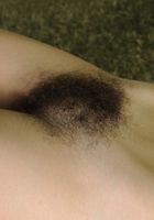 ATK Natural & Hairy: Sativa Verte (Hairy Sativa poses outside)